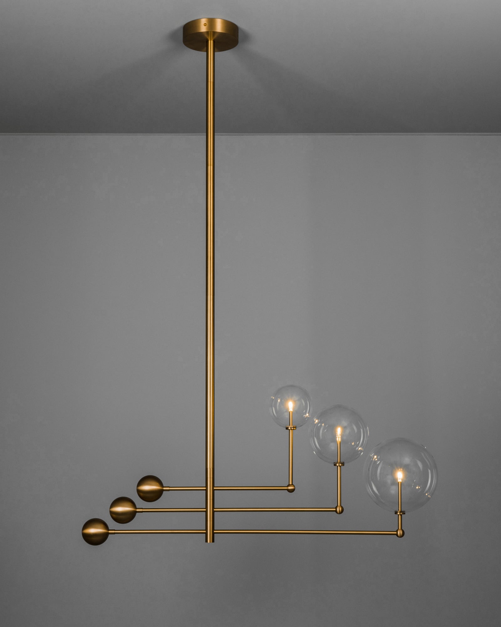 Schwung Universe Burnished Brass Transparent Globe Chandelier